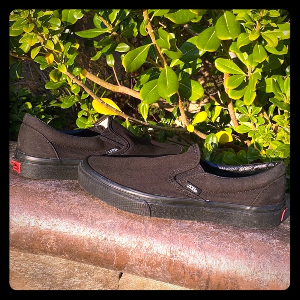 Vans black slip on sneakers
